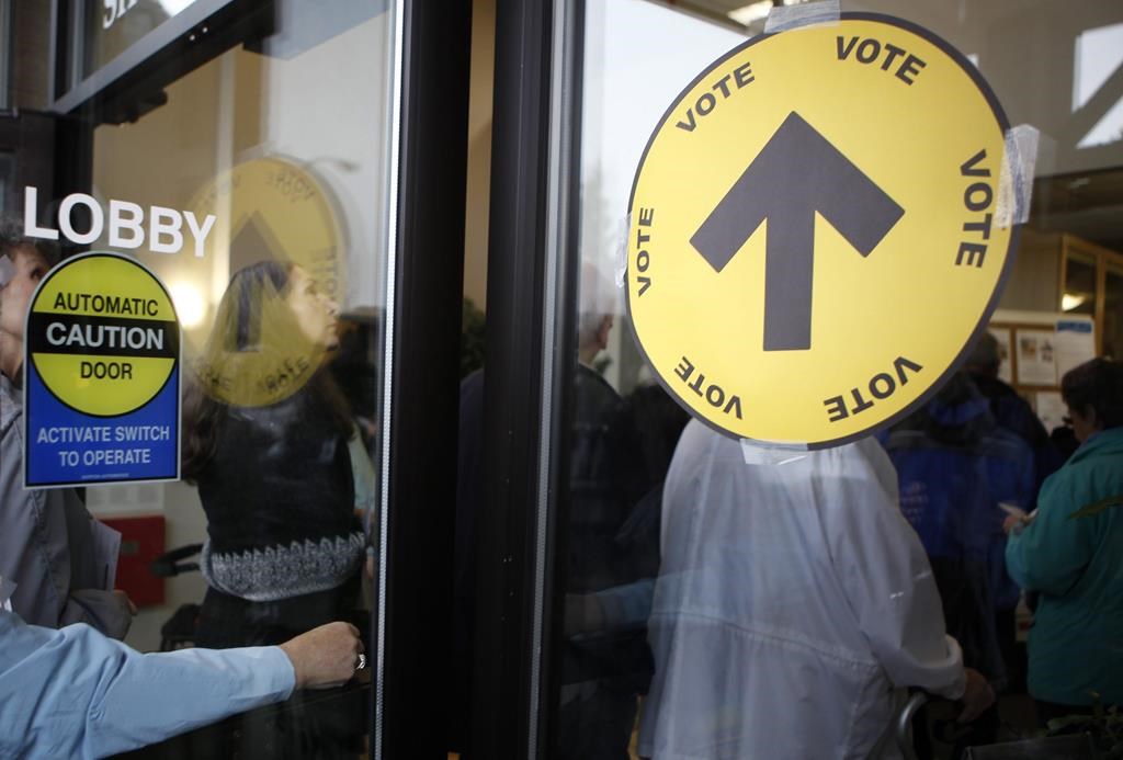 yellow vote sign on election day