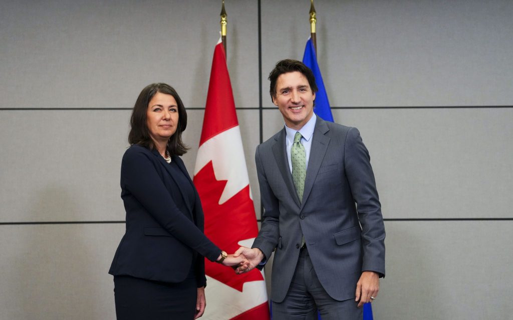 Smith and Trudeau shake hands