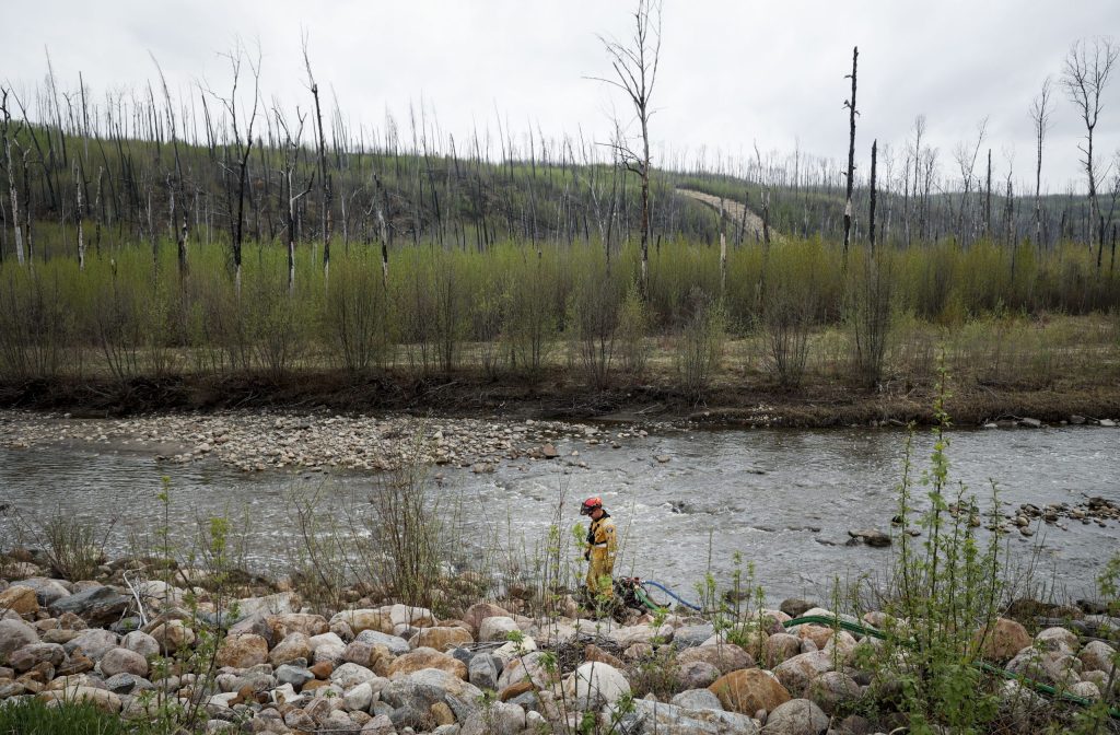 Fort McMurray wildfire status changed from out-of-control to 'being held'