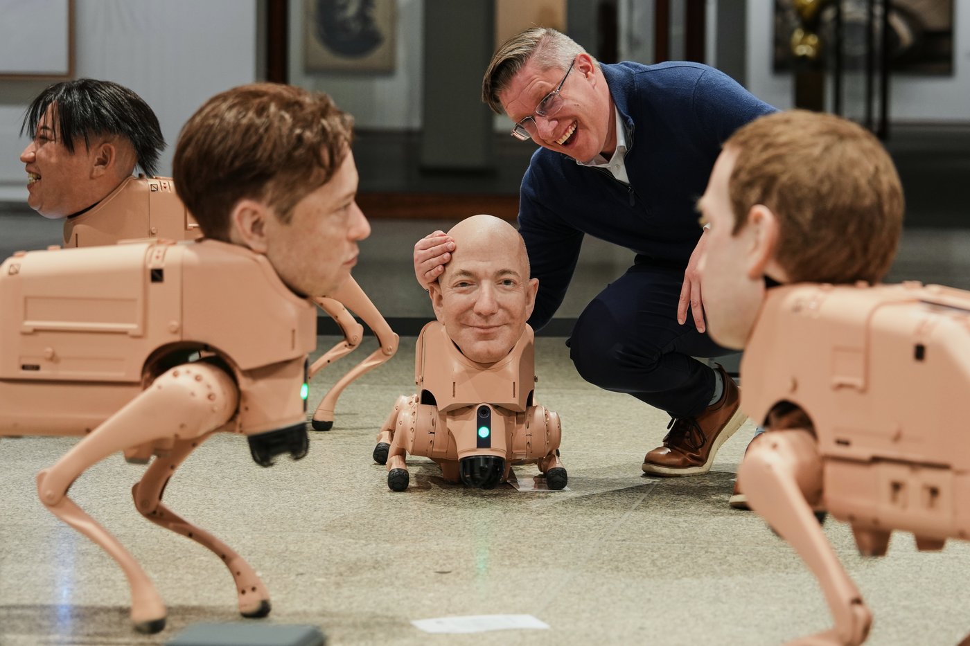 Robot dogs with Musk and Zuckerberg heads roam around Berlin gallery in ...