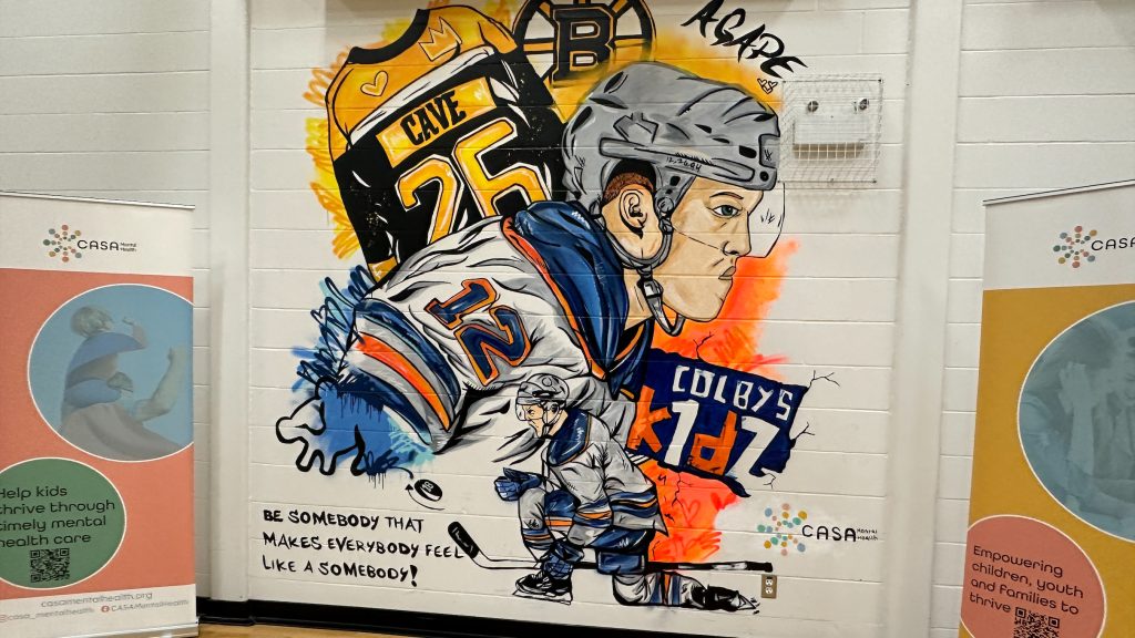 Mural honouring late Edmonton Oilers player Colby Cave unveiled at CASA Centre