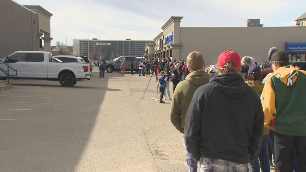 Edmonton collectors flock to popular hobby shop on National Hockey Card Day