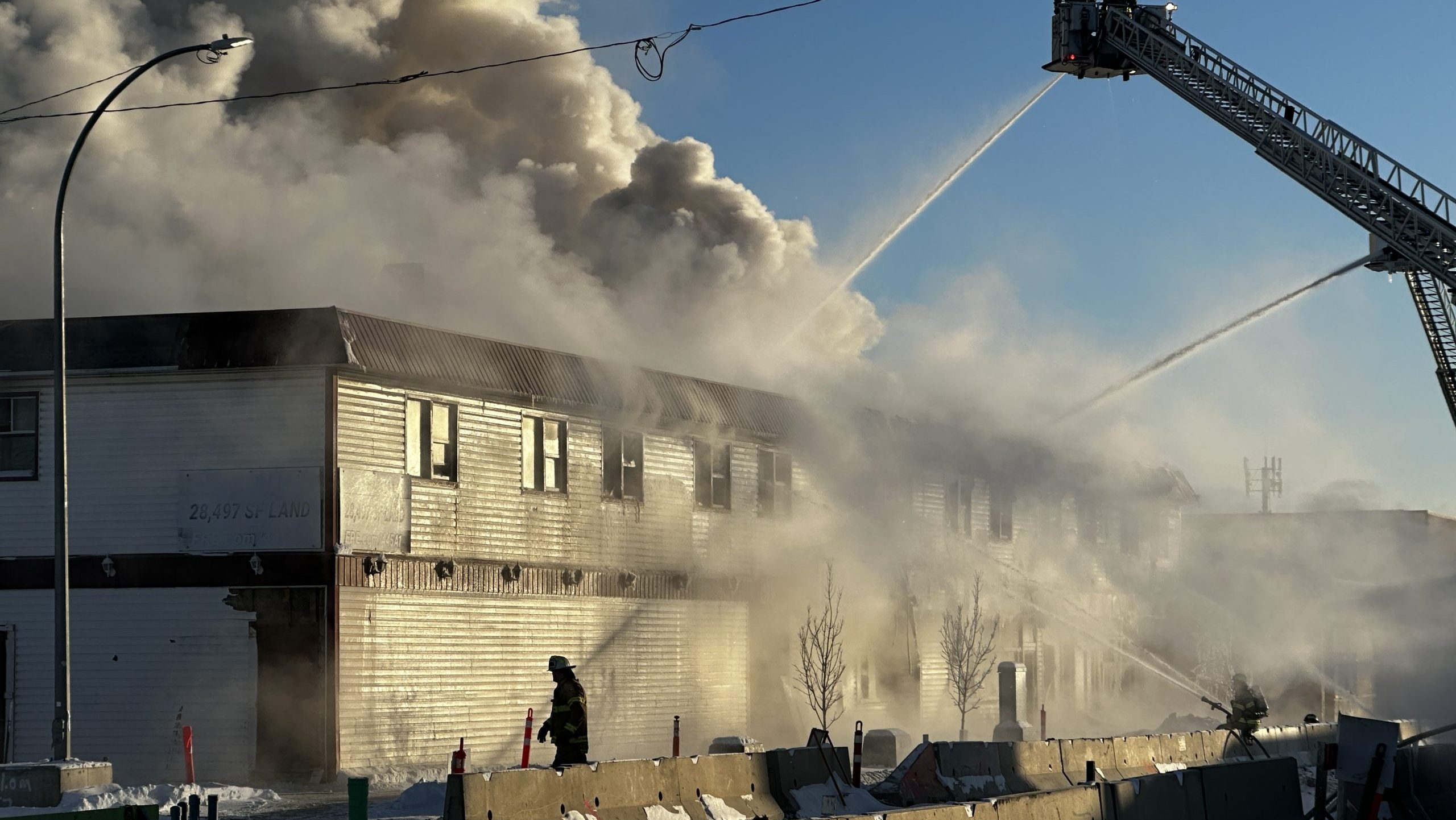 Edmonton firefighters working to put out blaze at Jasper Place Hotel