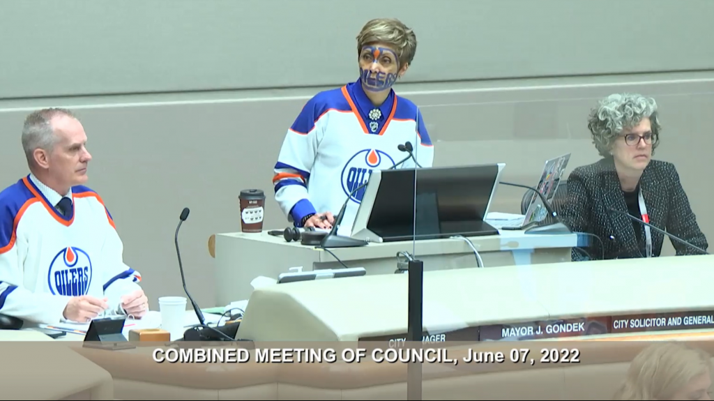 Battle of Alberta Calgary mayor wears Edmonton Oilers jersey at city council