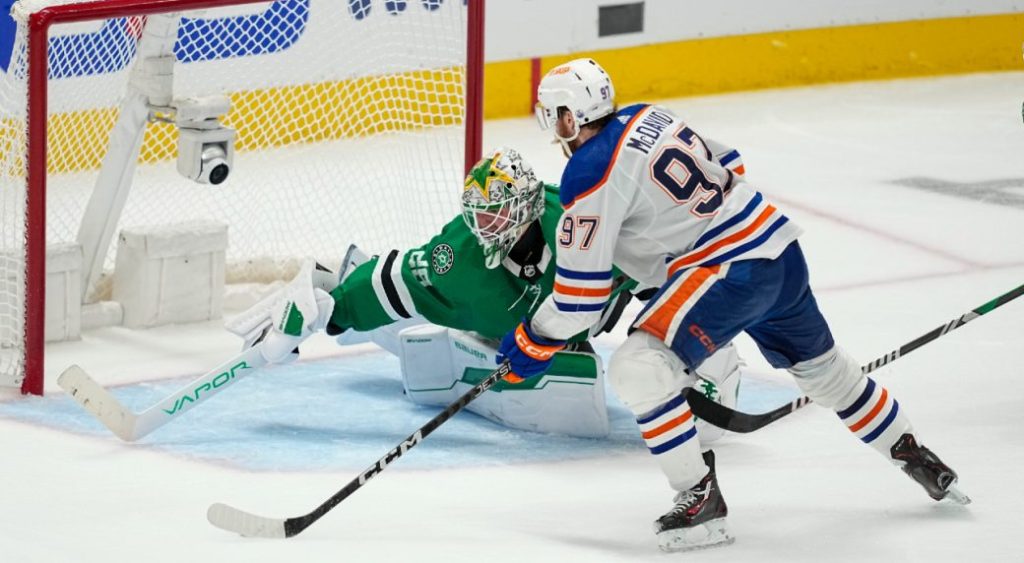 Edmonton Oilers centre Connor McDavid (97) prepares to shoot against Dallas Stars goaltender Jake Oettinger (29) during overtime in Game 1 of the NHL hockey Western Conference Stanley Cup playoff finals, Thursday, May 23, 2024, in Dallas. (Tony Gutierrez/AP)