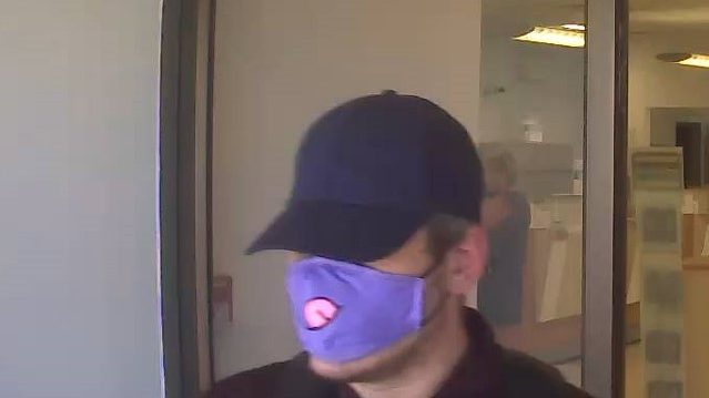 Mask man exiting CIBC Bank in Spruce Grove