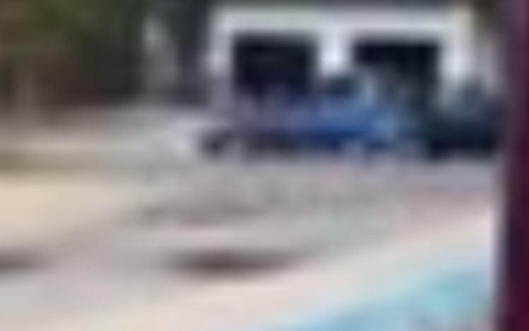 A blurry image of a blue sedan supplied by Grande Prairie RCMP. The driver reportedly struck a teen, then apologized before taking off on Saturday, Sept. 14. 2024