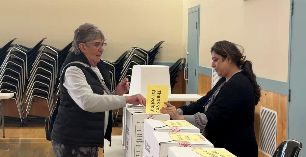Photo of anEdmontonian casting her ballot in the 2025 municipal elections