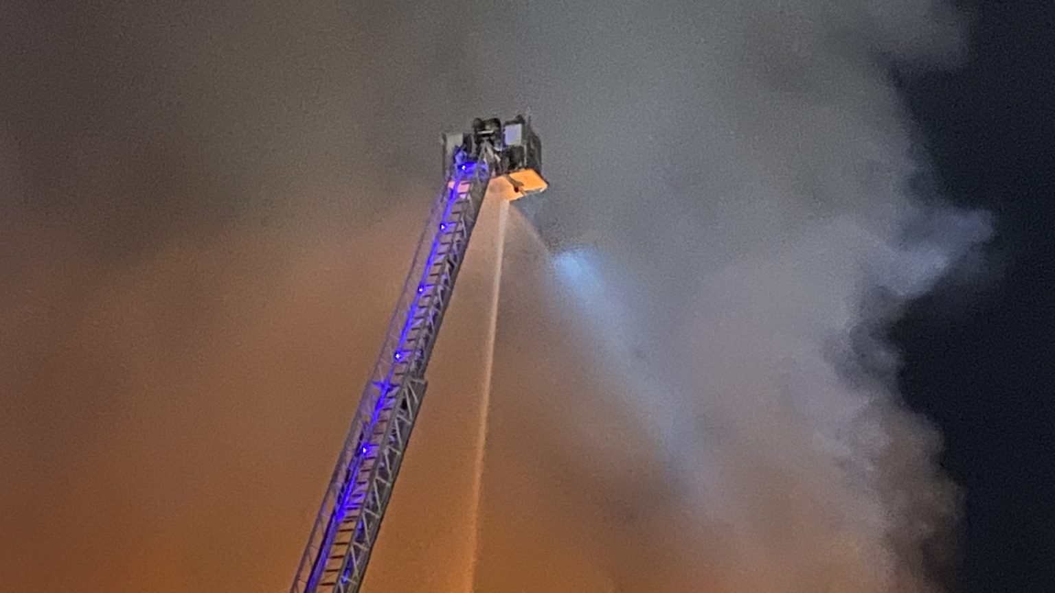 Crews work to extinguish massive warehouse fire in north central Edmonton